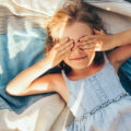 Beautiful,Blonde,Little,Girl,Lying,On,The,Blanket,,Cover,Her